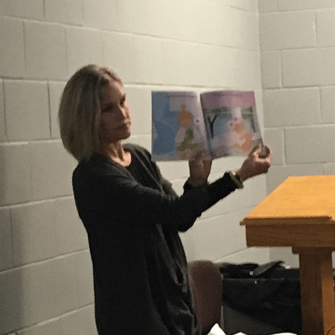 Karin Larson Holding A Book